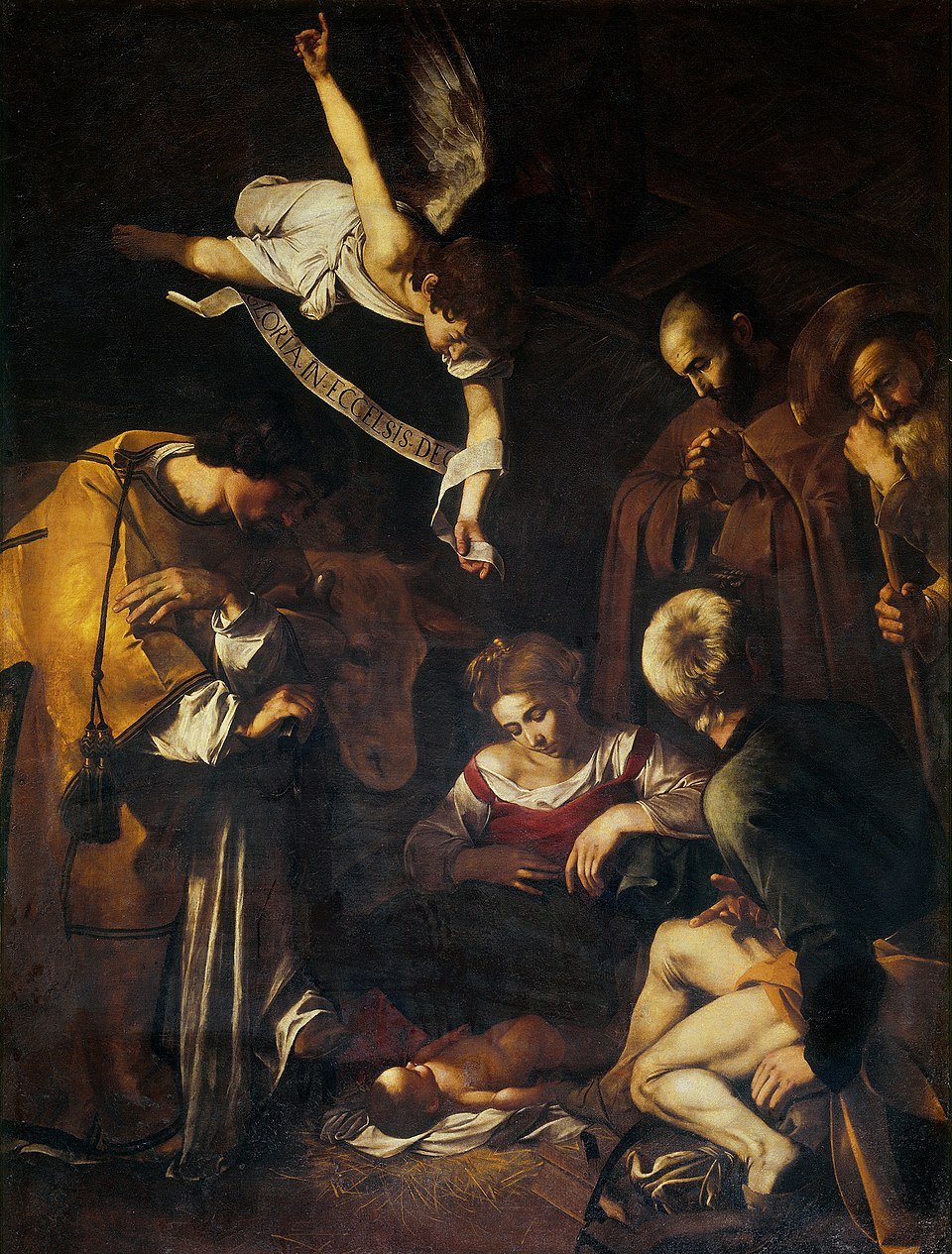 Caravaggio's 1600 Baroque masterpiece 'Nativity with St Francis and St Lawrence' depicts the birth of Christ with dramatic chiaroscuro, illustrating the divine infant who, as St Bernard wrote, veils his glory to draw humanity near