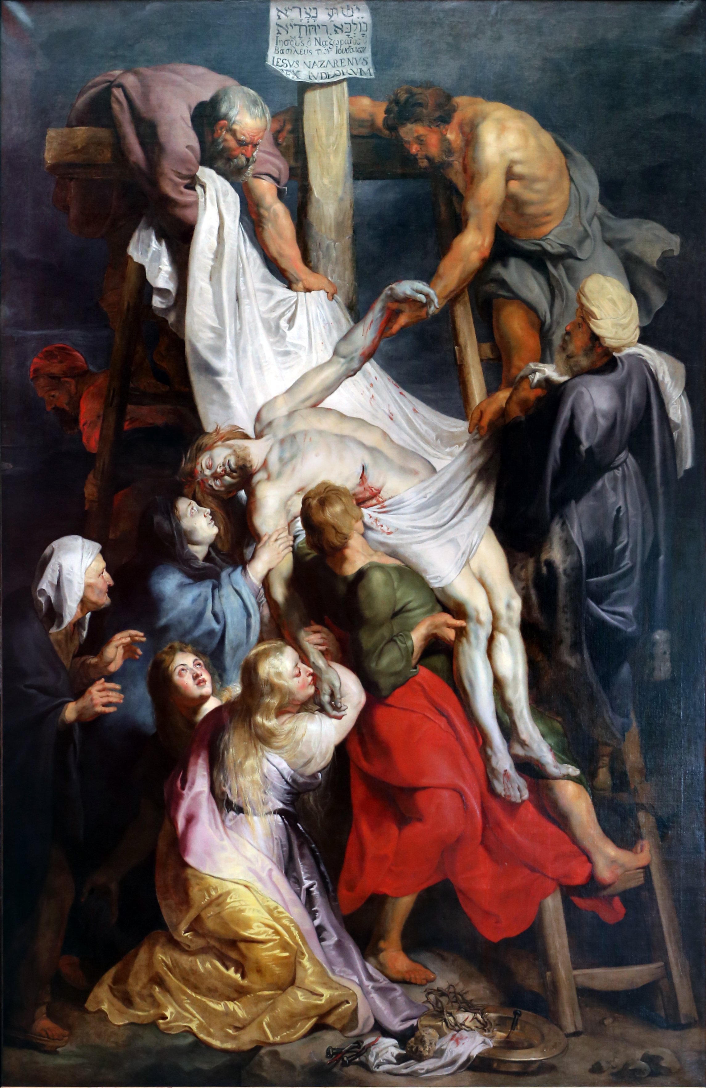 Peter Paul Rubens' 1616-1617 Baroque masterpiece 'The Descent from the Cross' dramatically depicts Joseph of Arimathea and Nicodemus lowering Christ's lifeless body, poignantly capturing the sorrowful mystery of the Crucifixion in oil on panel at Antwerp Cathedral